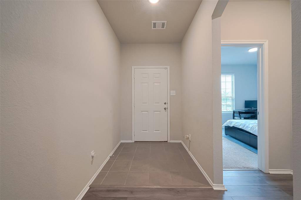 The new tile, fresh paint, and the nice neutral wall paint throughout this family home.