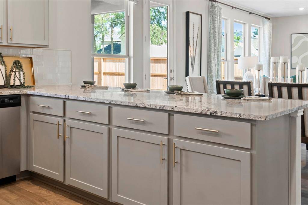 View of the gorgeous cabinetry and granite counter space which provides plenty of space.