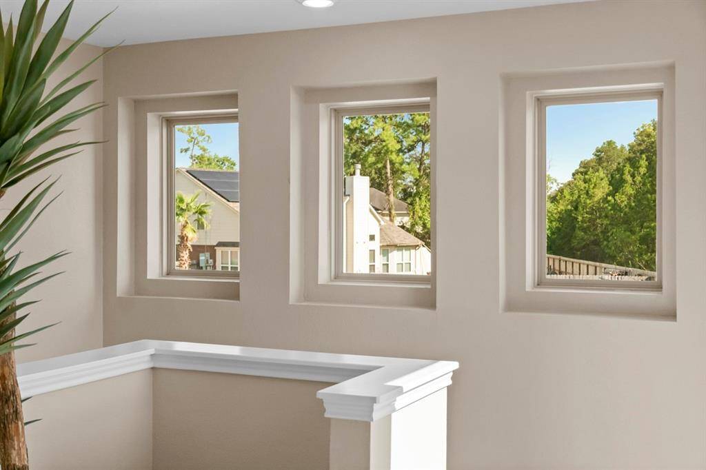 The custom touches of this home are stunning. As you enter the second floor living space, you are greeted with these beautiful windows that allow natural light to brighten this space.