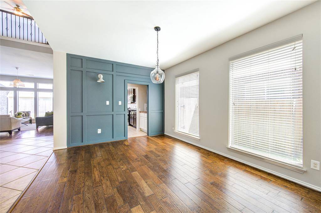 The wood accent walls provide a touch of elegance and subtle comfort. The rich wall colors compliment the beautiful wood floors.