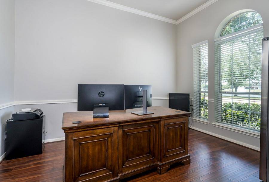 Working from home is a joy in this study with soring ceilings and big windows.