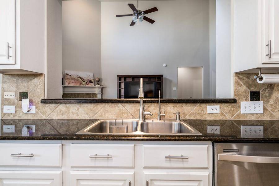 The cook is never far from the action because the kitchen is open to the oversized living area.