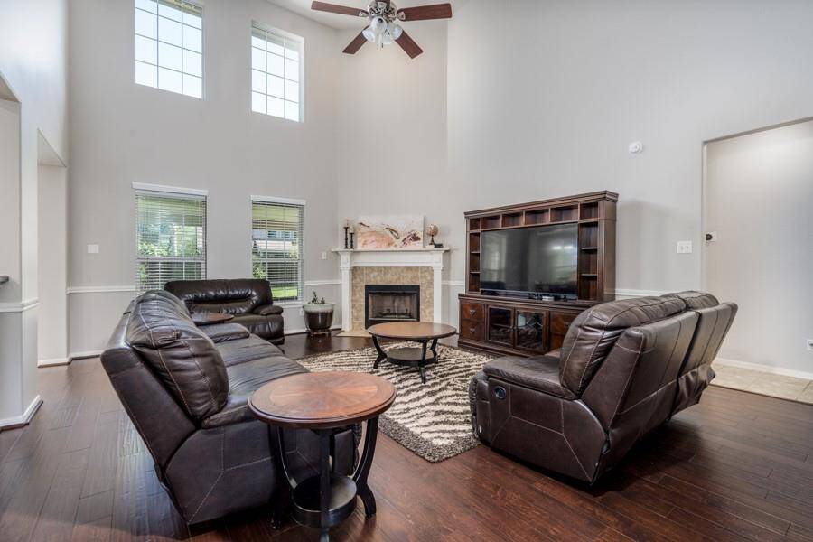 The soaring ceiling of the living room makes this huge room seem even bigger.