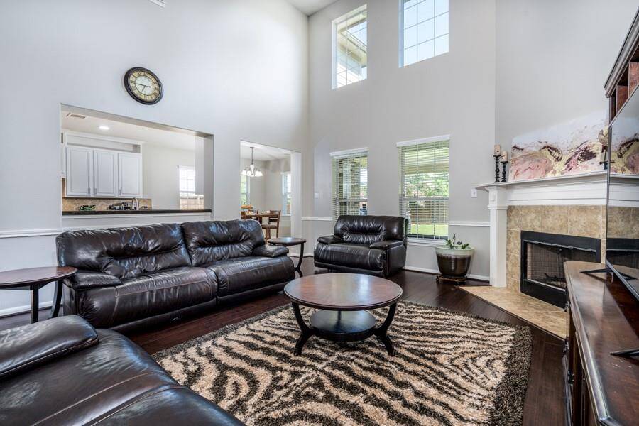 A view of the massive living area from the hall off the first floor primary bedroom.