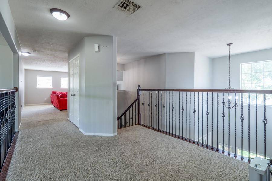 This upstairs landing takes you to the second primary living space equiped with it's own den, generous bath as well as the largest bedroom in the entire home!