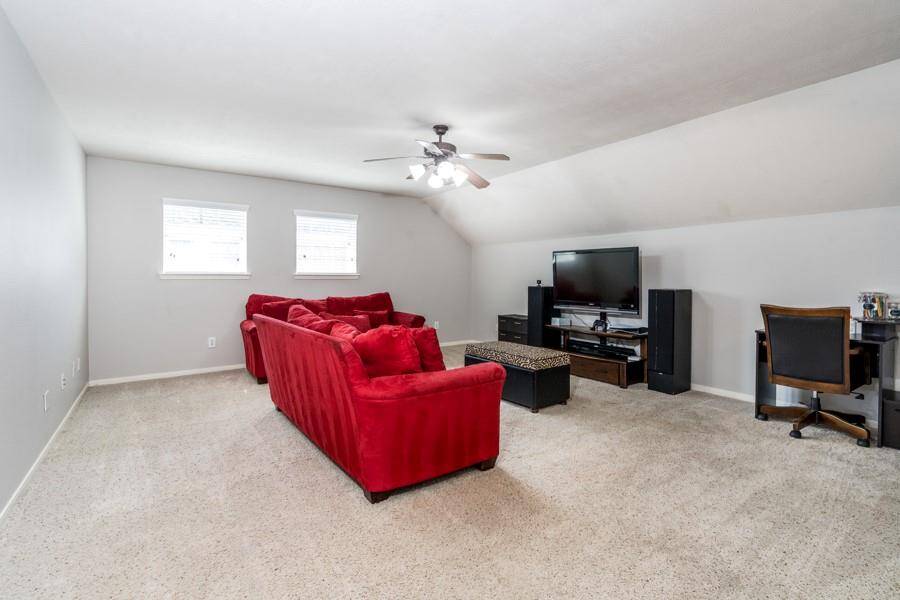 The upstairs primary suite has its own private den.