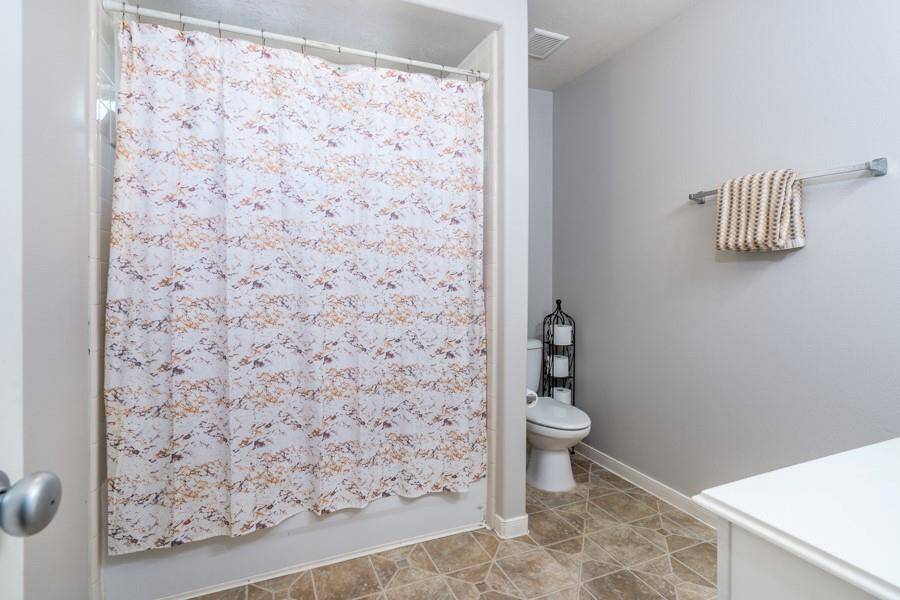This bathroom is shared by the 2 secondary bedrooms on this side of the house.