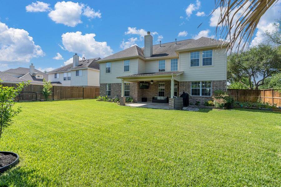 You'll enjoy this large, pool size and mature back yard and covered back patio.