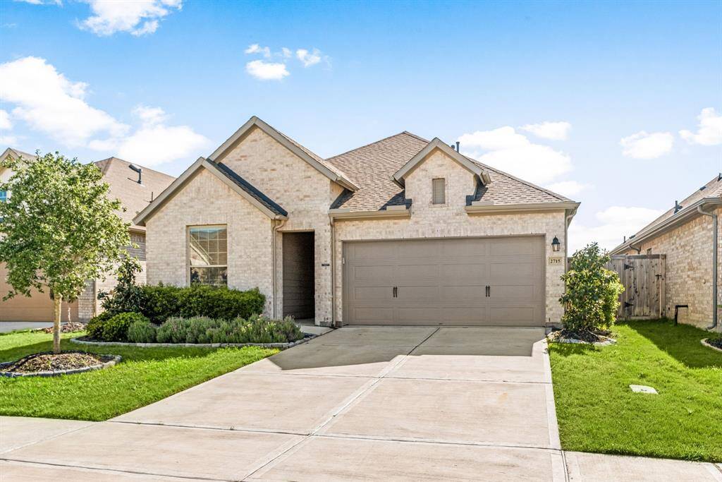 Lush, manicured lawn with charming curb appeal