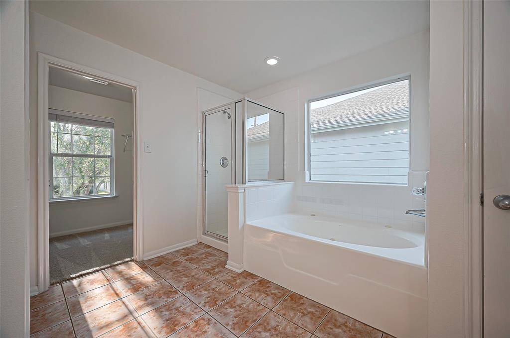 Separate shower and large jetted soaking tub