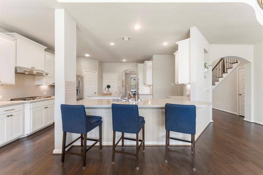 The kitchen is separate, but still part of the open space.