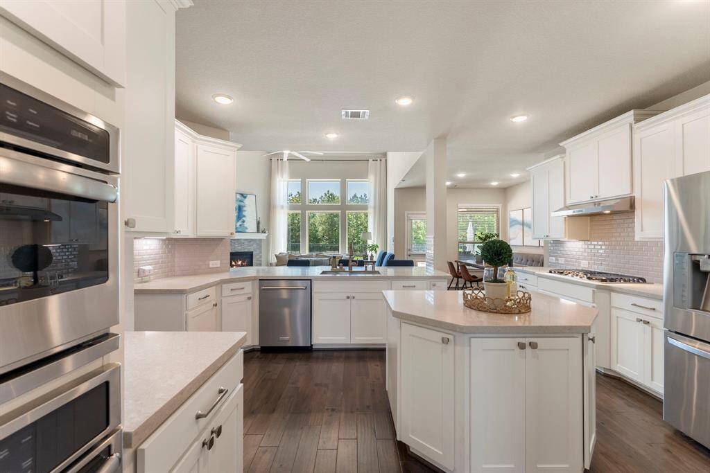 Kitchen has views to family room, breakfast area and an entrance to formal dining room and foyer.