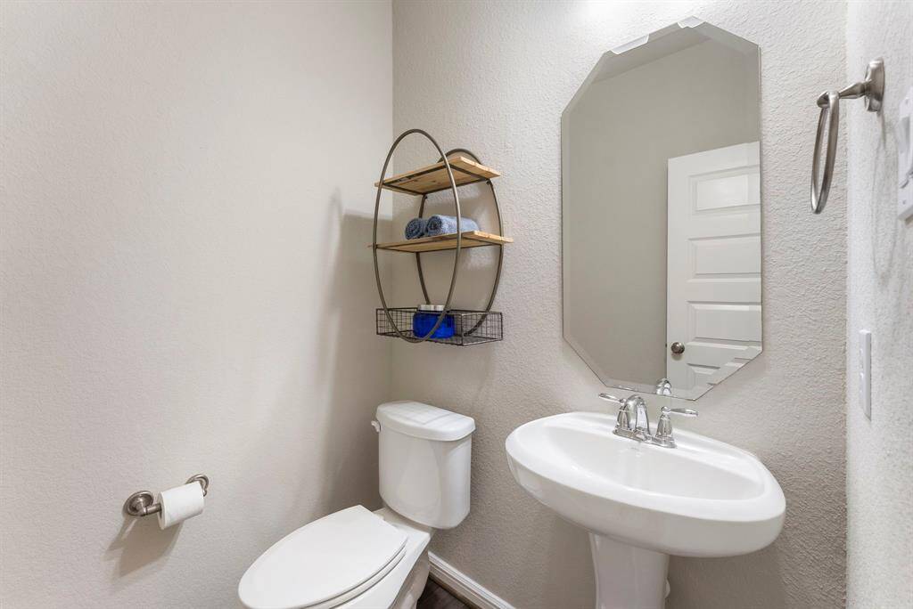 Powder bath on first floor just past entry foyer.