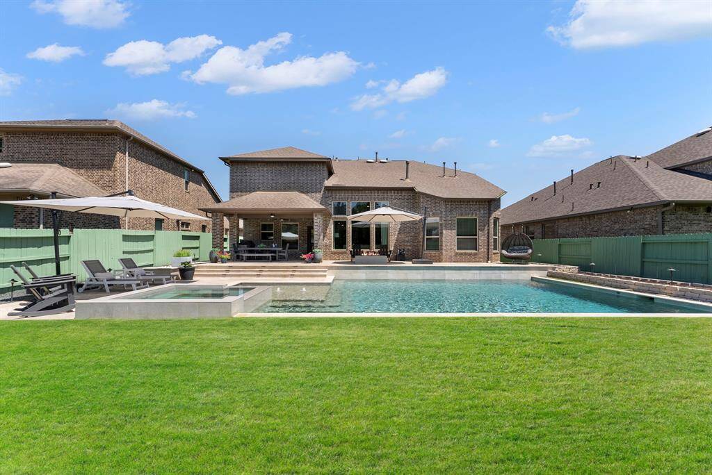 This beautiful home built by Taylor Morrison w/4 bedrooms, 3.1 baths, 3 garages, a full brick exterior, generator, and a large covered patio, is perfect for entertaining year round.