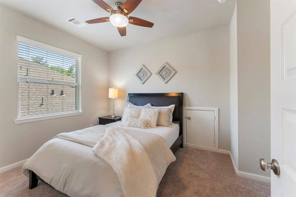 Second floor first bedroom at top of stairs features an en-suite bathroom.