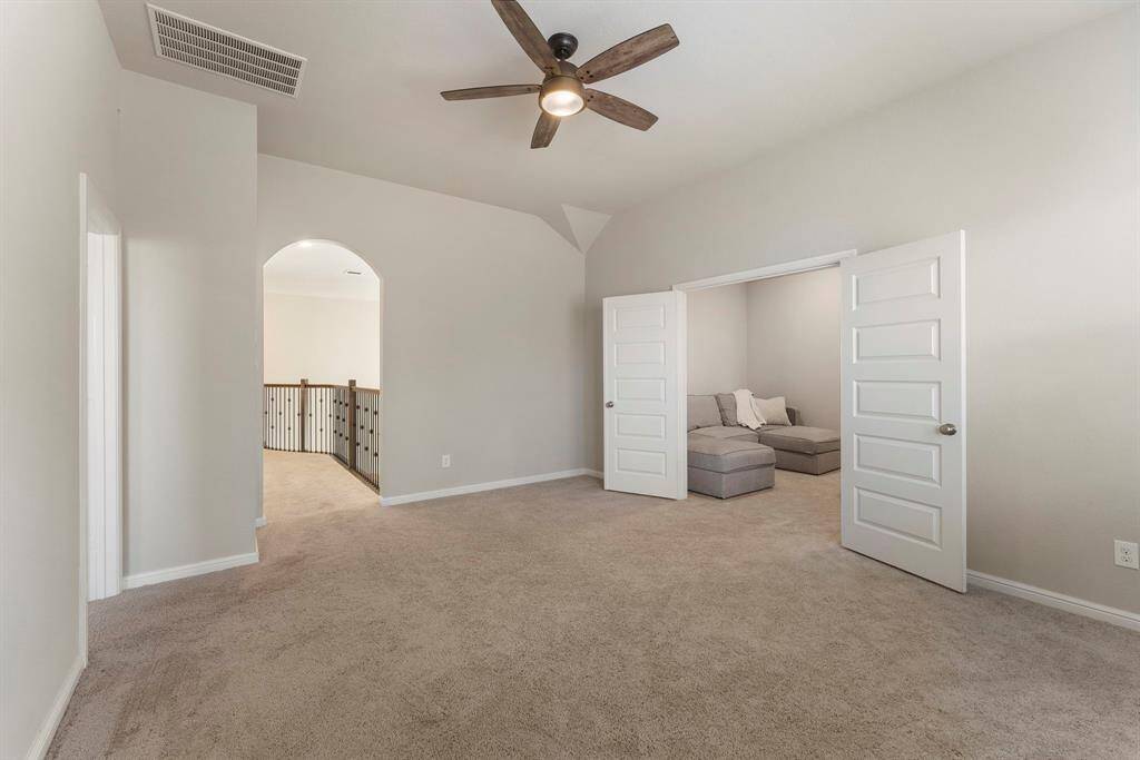 View to the walkway from stairs that overlooks family room on first floor.