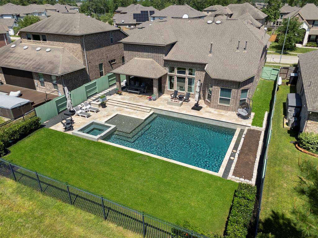 Looking at right side of pool next to wood privacy fence is the garden area that is irrigated and has been pre-prepped for the Spring/Summer season just waiting for plant selections from the new owners.