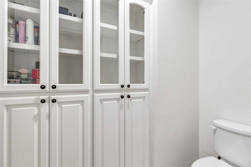 primary bath toilet area with built ins