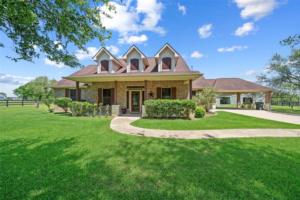 Welcome home! This charming brick ranch house with its inviting front porch and manicured lawn is the perfect blend of country serenity and timeless style.