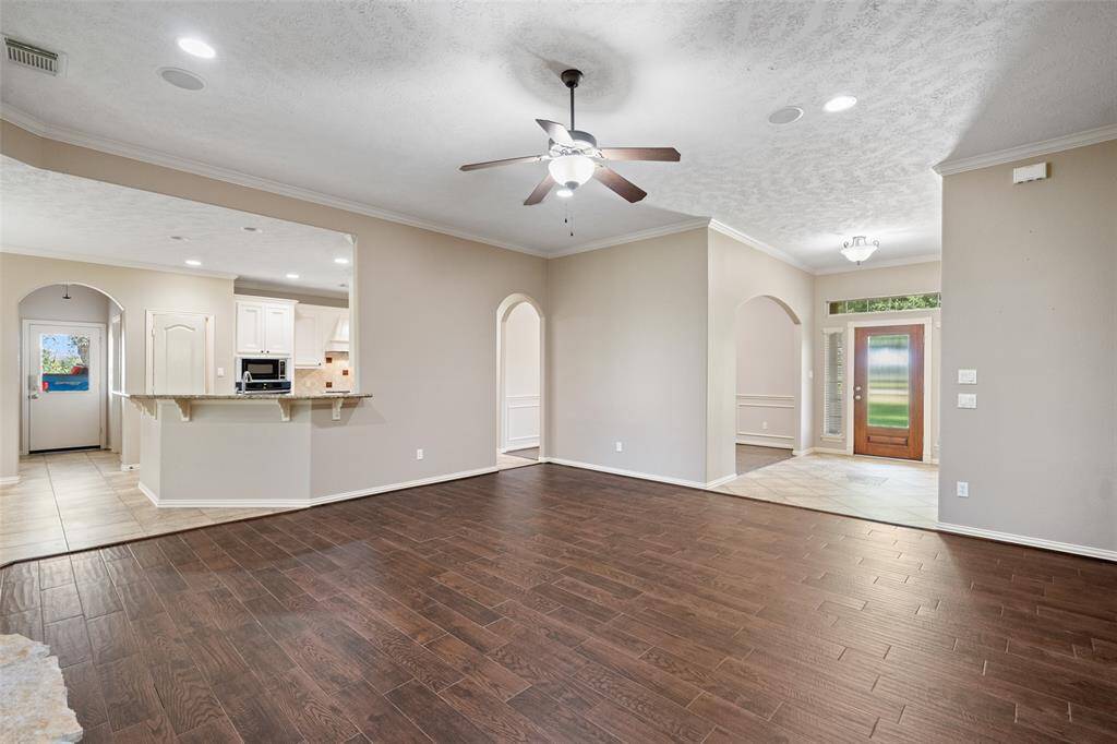 From the front entry to the back of the home, the open layout is bright, airy, and perfect for everyday living. The main living area flows seamlessly into the kitchen—ideal for movie nights, holiday gatherings, or cozy evenings in.