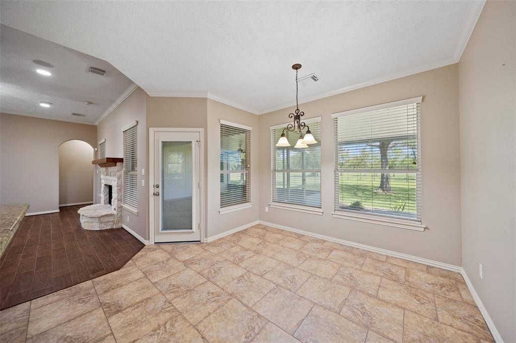 Enjoy your morning coffee with a view in this cheerful breakfast nook just steps from the kitchen and living room.