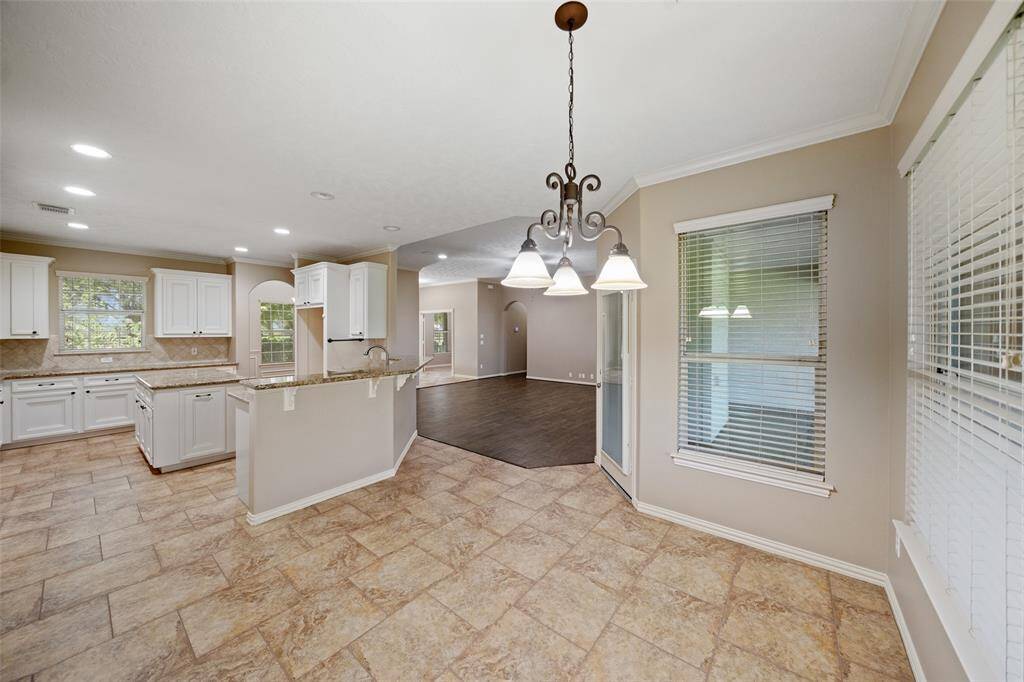 Conveniently located off the kitchen and living room, this bright space works great as a breakfast nook or casual dining spot.