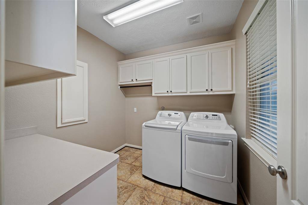 Plenty of room to spread out with upper cabinets for storage, a folding counter, and hanging space.