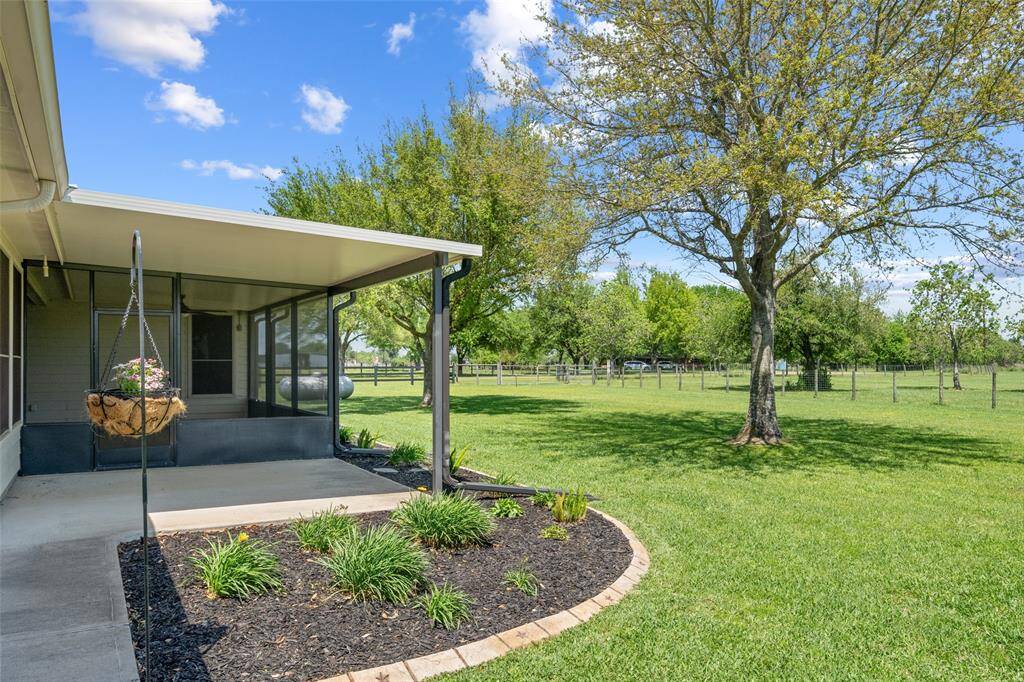 This thoughtful landscaping, with poured custom concrete edging, and extended patio area offers the perfect spot to unwind or garden.