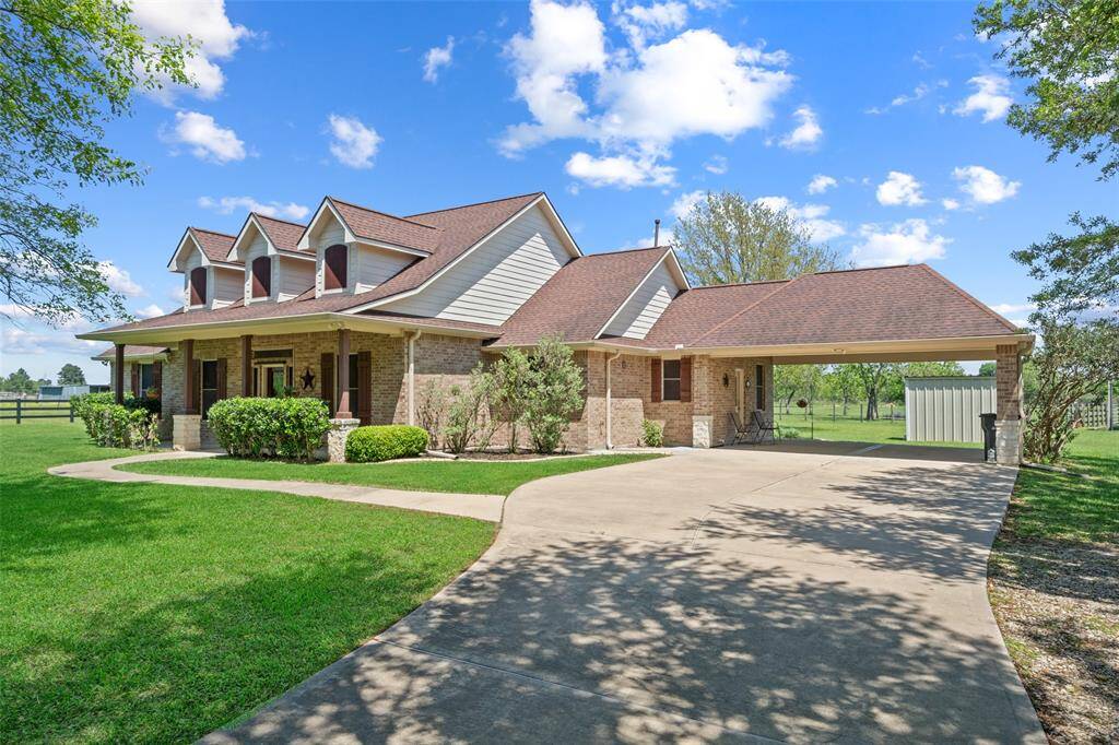 Plenty of curb appeal with extra room to park and play — the extended driveway and covered carport make everyday living easy and versatile.