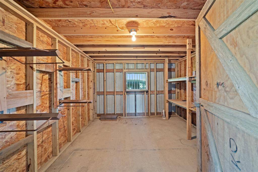 Custom shelves and built-in racks make this enclosed storage room perfect for tack, tools, or feed. Keep your operation running smoothly with everything right at your fingertips.