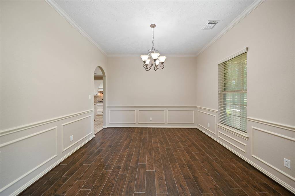 This dedicated dining room is just waiting for your next dinner party—refined finishes and easy kitchen access included!