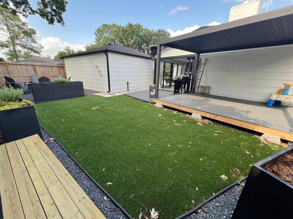 Backyard Turf and Powder Coated Steel Louvered Pergola