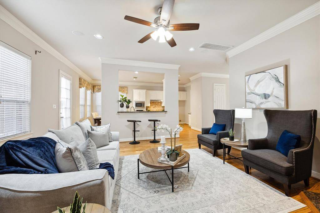 Large living room. Entire first floors have hardwood floors and crown molding.