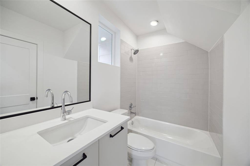 Elegant first-floor bathroom with modern fixtures and a sleek design.
