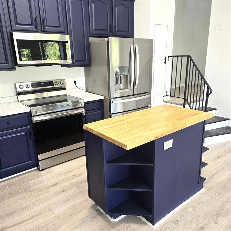 KITCHEN ISLAND AND NEW STAINLESS STEEL APPLIANCES