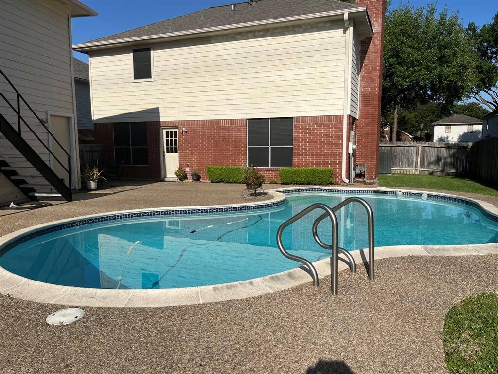This charming 4-bedroom, 2-story brick home with a sparkling pool and garage apartment is nestled on a quiet street in the highly desirable Sugar Creek neighborhood.