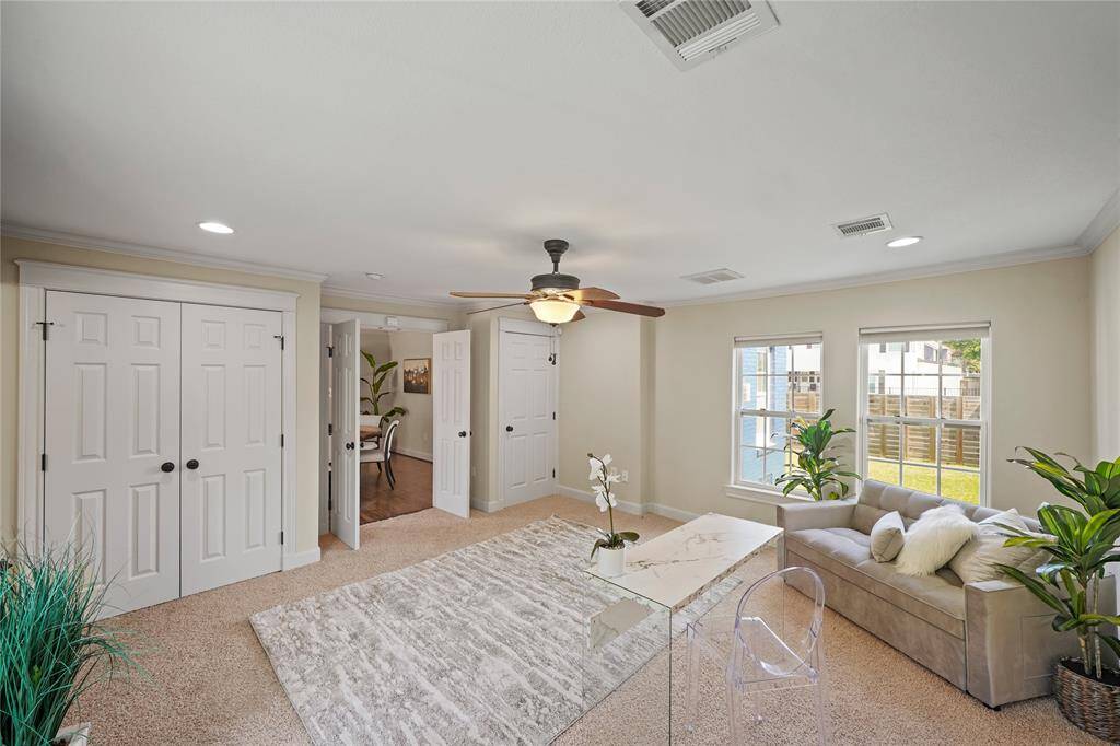 Bathed in natural light, the room features an abundance of closet space, creating an inviting and functional atmosphere.