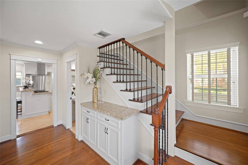 Additional storage in the foyer and a convenient half bath add to the home's thoughtful layout.
