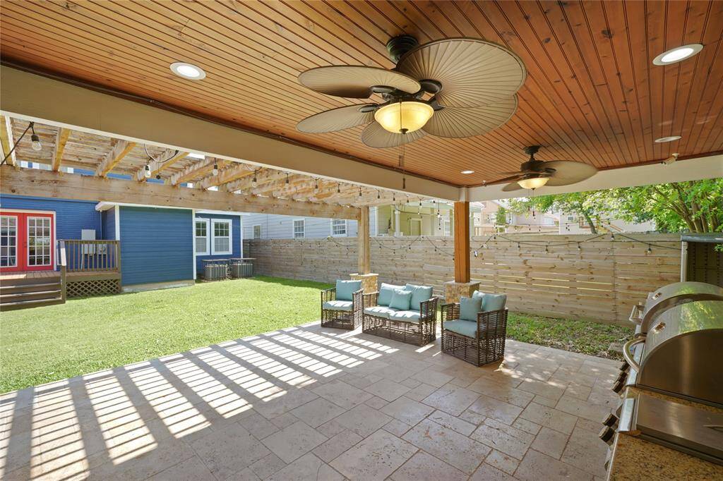 The outside retreat features a partial covering, providing a perfect space to relax and enjoy the day's weather in comfort.