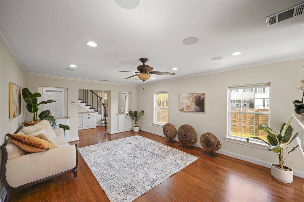 Notice the functional built-in cabinetry with granite counters that separates the entryway from the main living area, adding both style and practical storage.