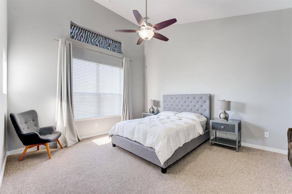 Primary bedroom on the 3rd floor, with large windows, reading area, and an abundace of space!