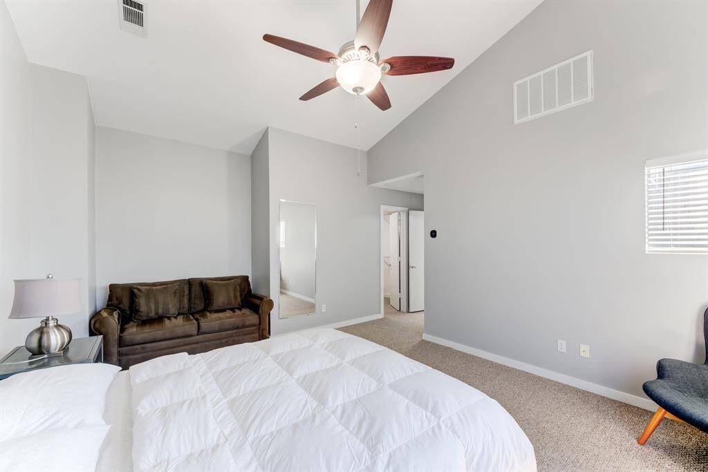 Primary bedroom on the 3rd floor, with large windows, reading area, and an abundace of space!