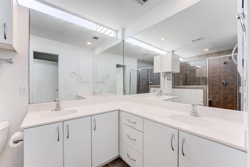 Primary bathroom boasts his and her sink, with garden tub and separate walk-in shower!