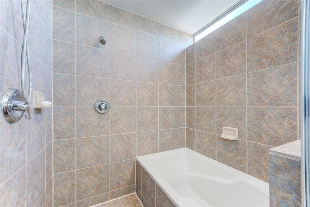 Primary bathroom boasts his and her sink, with garden tub and separate walk-in shower!