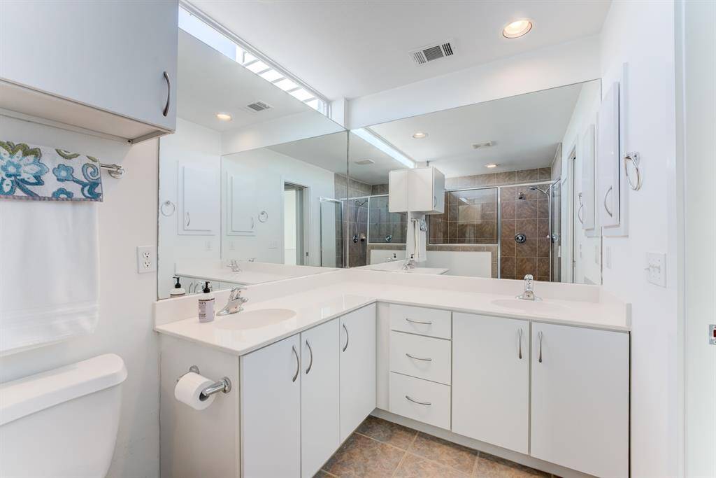 Primary bathroom boasts his and her sink, with garden tub and separate walk-in shower!