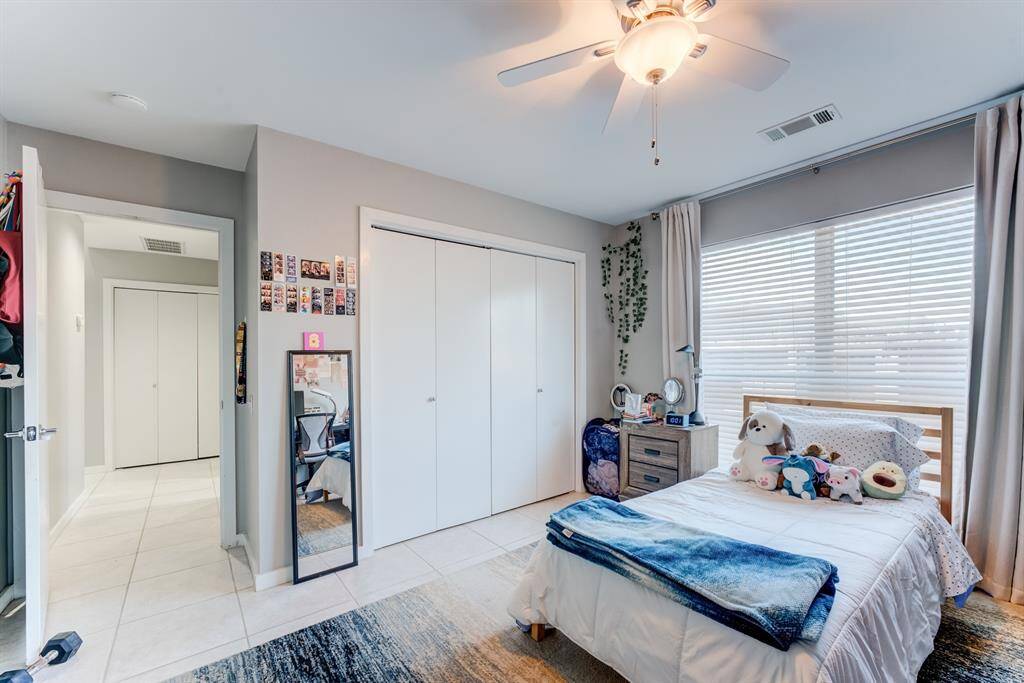 Bright Guest Bedroom on 1st floor, with spacious closet and easy access to the patio or guest parking!
