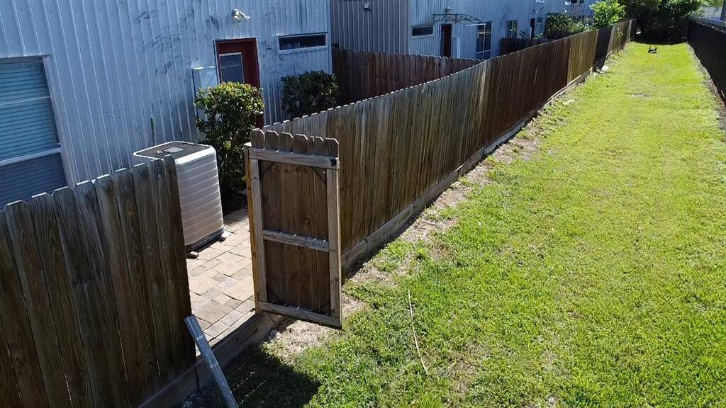 Back gate opens to large green space to easily walk your furry friends or enjoy a nice evening walk!