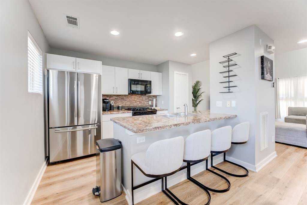 Breakfast bar centered around the kitchen island!