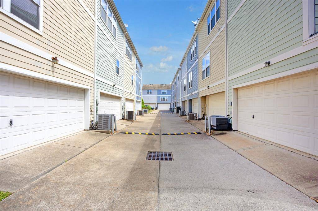View of the shared driveway.  Visitor spots are at the end of this driveway and to the left.  Very convenient for guests!