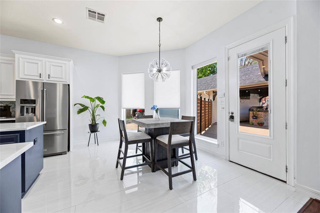 Bright breakfast nook surrounded by windows with tranquil views of your tropical paradise and lush landscaping.